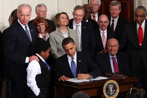 WASHINGTON - MARCH 23: U.S. President Barack Obama signs the Affordable Health Care for America Act during a ceremony with fellow Democrats in the East Room of the White House March 23, 2010 in Washington, DC. The historic bill was passed by the House of Representatives Sunday after a 14-month-long political battle that left the legislation without a single Republican vote. (Photo by Win McNamee/Getty Images) WASHINGTON - MARCH 23: U.S. President Barack Obama signs the Affordable Health Care for America Act during a ceremony with fellow Democrats in the East Room of the White House March 23, 2010 in Washington, DC. The historic bill was passed by the House of Representatives Sunday after a 14-month-long political battle that left the legislation without a single Republican vote. (Photo by Win McNamee/Getty Images)