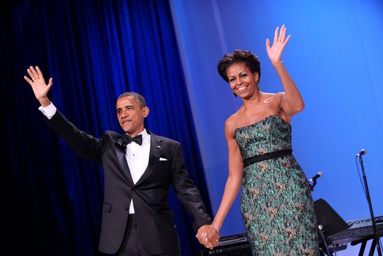 WASHINGTON, DC - SEPTEMBER 14:  (AFP-OUT)  U.S. President Barack Obama (L) and First Lady Michelle Obama wave during the Congressional Hispanic Caucus Institute's 34th Annual Awards Gala at the Washington Convention Center on September 14, 2011 in Washington, DC. Obama spoke about the $447 billion package of tax cuts as well as public spending and new jobs plan. (Photo by Olivier Douliery-Pool/Getty Images)