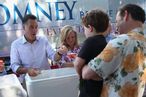 MILFORD, NH - JUNE 15: Republican Presidential candidate, former Massachusetts Governor Mitt Romney and his wife Ann Romney scoop ice cream for people during a campaign event at the Milford Ice Cream Social on June 15, 2012 in Milford, New Hampshire. Mr. Romney is starting a five day swing through battle ground states as he battles President Barack Obama for votes. (Photo by Joe Raedle/Getty Images)