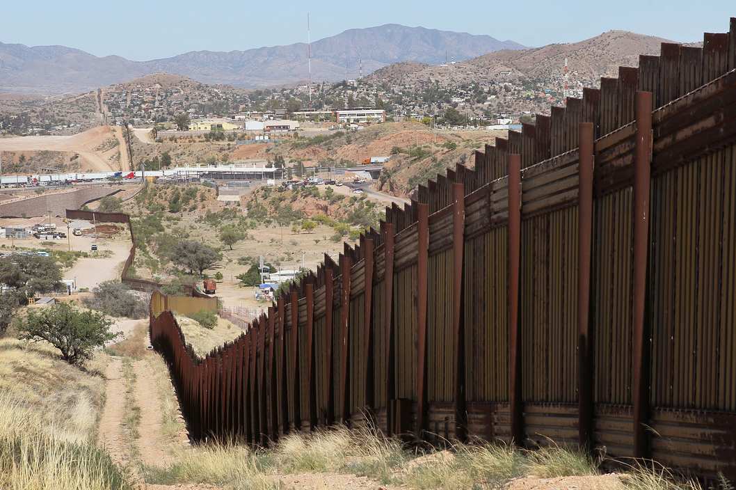 NOGALES, AZ - JUNE 02: A fence separates the cities of Nogales, Arizona (L) and Nogales, Sonora Mexico, a frequent crossing point for people entering the United States illegally, June 2, 2010 in Nogales, Arizona. During the 2009 fiscal year 540,865 undocumented immigrants were apprehended entering the United States illegally along the Mexican border, 241,000 of those were captured in the 262 mile stretch of the border known as the Tucson Sector. (Photo by Scott Olson/Getty Images)