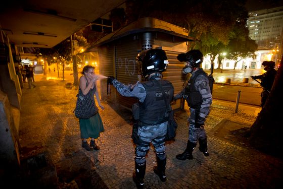 A military police peper sprays a protester during a demonstration aga in Rio de Janeiro, Brazil, Monday, June 17, 2013. (AP Photo/Victor R. Caivano)