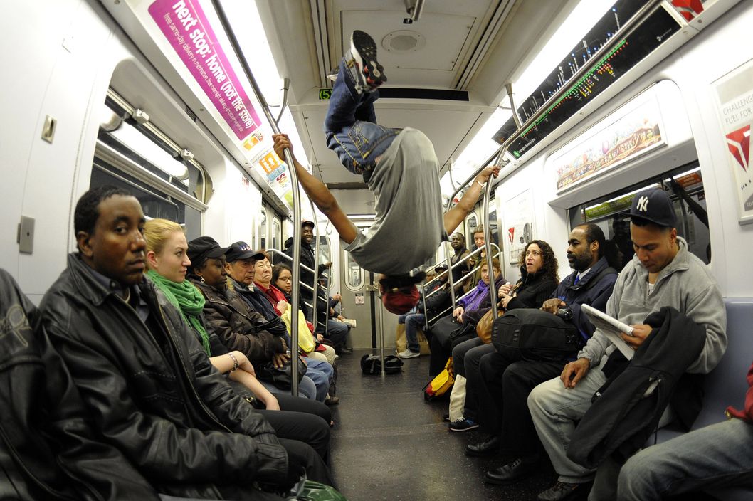 New York City Subway dancer Marcus Walden ( Mr Wiggles)  performs with other members of his dance crew November 23, 2010. The dance crew of Donte Steele (Thebestuknow); Tamiek Steele ( B/Boy LJ) and Marcus Walden ( Mr Wiggles) perform their roughly 45-second routine between stops on the train running from 125th Street in Harlem to the Brooklyn Bridge.