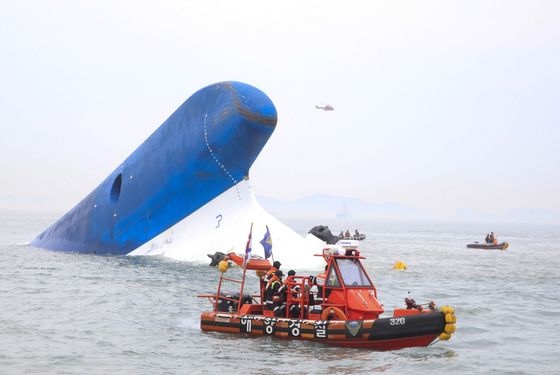 In this handout provided by Donga Daily, The Republic of Korea Coast Guard work at the site of ferry sinking accident off the coast of Jindo Island  on April 16, 2014 in Jindo-gun, South Korea. Four people are confirmed dead and almost 300 are reported missing. The ferry identified as the Sewol is reported to have been carrying around 470 passengers, including students and teachers, as it travelled to Jeju island. 
