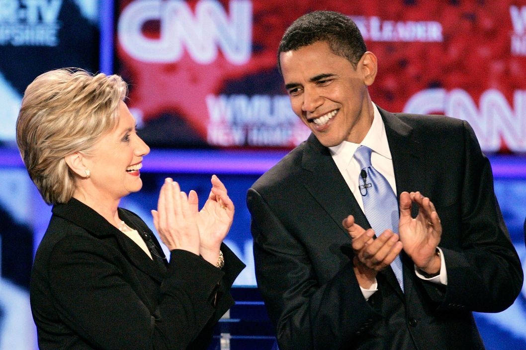Democratic presidential candidates Senators Clinton and Obama applaud prior to a debate at Saint Anselm College in Manchester