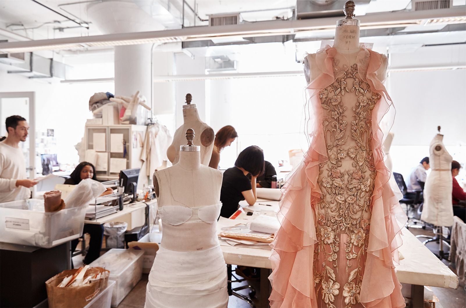 Marchesa dresses on doll forms in various states of completion