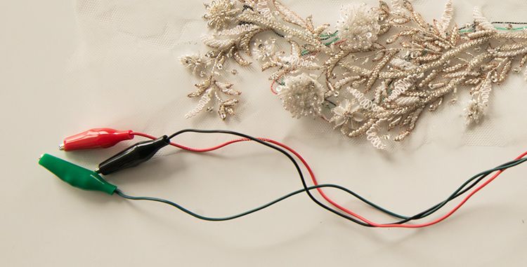 Three wires and a trail of beadwork during production