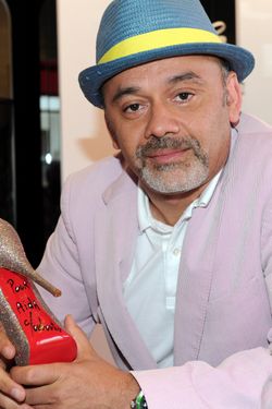 WEST HOLLYWOOD, CA - APRIL 28:  Designer Christian Louboutin poses for a photo at the grand opening of the new Christian Louboutin boutique on April 28, 2010 in West Hollywood, California.  (Photo by Alberto E. Rodriguez/Getty Images)
