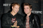 LOS ANGELES, CA - NOVEMBER 06: Actors Kellan Lutz (L) and Robert Pattinson appear onstage at Summit's "The Twilight Saga: New Moon" Cast Tour at Hollywood and Highland on November 6, 2009 in Los Angeles, California. (Photo by Kevin Winter/Getty Images) *** Local Caption *** Kellan Lutz;Robert Pattinson LOS ANGELES, CA - NOVEMBER 06: Actors Kellan Lutz (L) and Robert Pattinson appear onstage at Summit's "The Twilight Saga: New Moon" Cast Tour at Hollywood and Highland on November 6, 2009 in Los Angeles, California. (Photo by Kevin Winter/Getty Images) *** Local Caption *** Kellan Lutz;Robert Pattinson