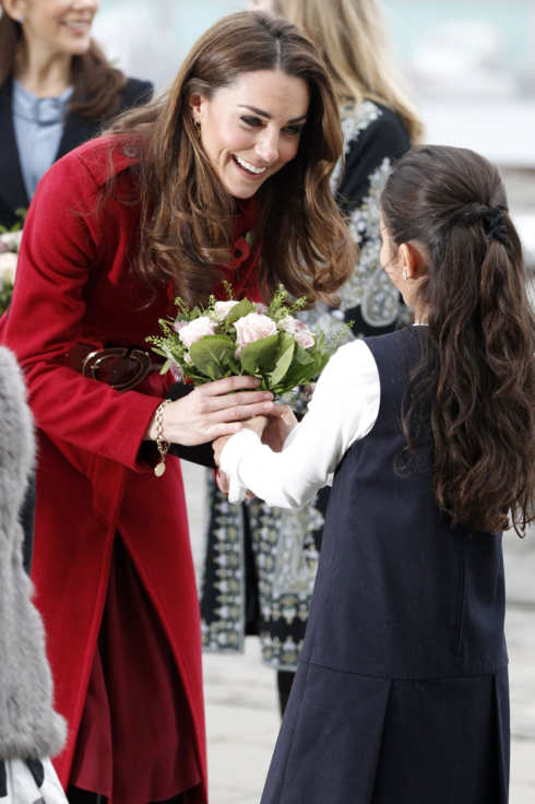 COPENHAGEN, DENMARK - NOVEMBER 2: Catherine, Duchess of Cambridge is presented with a bouquet of flowers as she arrives for a visit to the UNICEF Emergency Supply Centre on November 2, 2011 in Copenhagen, Denmark. Catherine, Duchess of Cambridge and Prince William, Duke of Cambridge visited the centre to view efforts to distribute emergency food and medical supplies to eastern Africa where severe food shortages are affecting more than 13 million people. (Photo by Phil Noble - WPA Pool/Getty Images)
