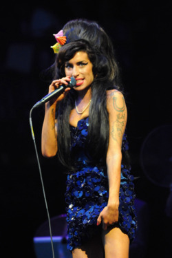 GLASTONBURY, UNITED KINGDOM - JUNE 28:  Amy Winehouse performs on the Pyramid stage during day two of the Glastonbury Festival at Worthy Farm, Pilton on June 28, 2008 in Glastonbury, Somerset, England.  (Photo by Jim Dyson/Getty Images)