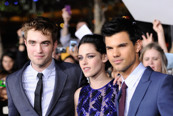 LOS ANGELES, CA - NOVEMBER 14:  (L-R) Actors Robert Pattinson, Kristen Stewart and Taylor Lautner arrive at Summit Entertainment's "The Twilight Saga: Breaking Dawn - Part 1" premiere at Nokia Theatre L.A. Live on November 14, 2011 in Los Angeles, California.  (Photo by Frazer Harrison/Getty Images)