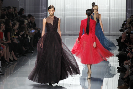 US model Karlie Kloss (L) presents a creation by British designer Bill Gaytten for Christian Dior during the Fall/Winter 2012-2013 ready-to-wear collection show, on March 2, 2012 in Paris.