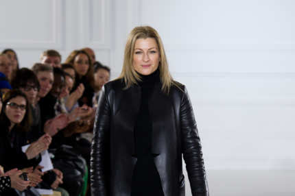 Designer Joanna Sykes appears on the runway after the Aquascutum show at London Fashion Week Autumn/Winter 2012 at The Savoy Hotel on February 18, 2012 in London, England.
