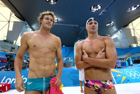 LONDON, ENGLAND - JULY 25:  (L-R) Kenrick Monk of Australia and Ryan Lochte of the United States look on from the pool deck during a training session ahead of the London Olympic Games at the Aquatics Centre in Olympic Park on July 25, 2012 in London, England.  (Photo by Al Bello/Getty Images)