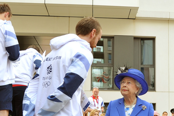 LONDON, UNITED KINGDOM - JULY 28:  Queen Elizabeth Il  meets one of the taller members of the Great Britain team during a tour of the Athletes Village on day one of the London 2012 Olympics Games on July 28, 2012 in London, England.  (Photo by John Stillwell/WPA Pool/Getty Images)