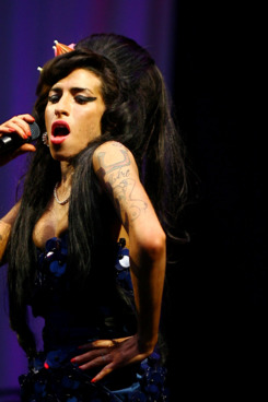 TO GO WITH AFP STORY BY PAUL RICARD British singer Amy Winehouse performs at the Glastonbury Festival at Worthy Farm, in Glastonbury on June 28, 2008. As the legendary Motown label turns 50, soul music is back and booming, ever since British diva Amy Winehouse hit world charts two years ago. The celebrated label , that brought Marvin Gaye, Stevie Wonder and Diana Ross to the world has been marked by a re-issue of its seminal tracks. AFP PHOTO/BEN STANSALL (Photo credit should read BEN STANSALL/AFP/Getty Images)