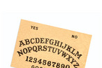 Image of a Ouija board - this is the original and vintage text arrangement of letters, numbers, and words. Image of a Ouija board - this is the original and vintage text arrangement of letters, numbers, and words.