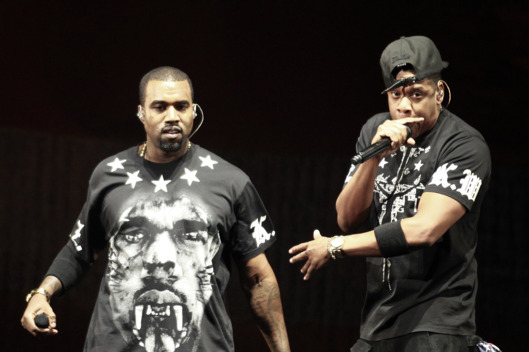 Kanye West, left, and Jay Z perform in concert during the "Watch The Throne" tour, Sunday, Nov. 6, 2011, in East Rutherford, N.J. (AP Photo/Julio Cortez)