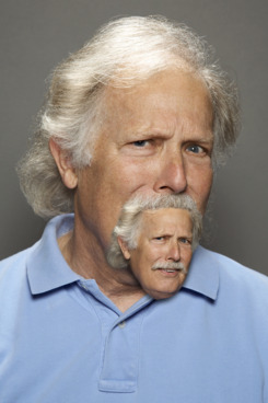 Man with grey hair looking skeptical