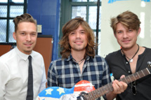 NEW YORK - OCTOBER 22: (L-R) Zac Hanson, Taylor Hanson, and Isaac Hanson of the band Hanson hold a guitar painted by the band during the VH1 Save the Music Foundation Family Day at the The Anderson School on October 22, 2011 in New York City. (Photo by Mike Coppola/Getty Images)