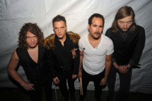 CHICAGO - AUGUST 09: (L-R) Dave Keuning, Brandon Flowers, Ronnie Vannucci Jr. and Mark Stoermer of The Killers pose backstage before performing during the 2009 Lollapalooza music festival at Grant Park on August 9, 2009 in Chicago, Illinois. (Photo by Jeff Gentner/Getty Images)