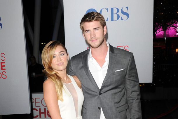 LOS ANGELES, CA - JANUARY 11: Singer Miley Cyrus and actor Liam Hemsworth arrive at the 2012 People's Choice Awards held at Nokia Theatre L.A. Live on January 11, 2012 in Los Angeles, California. (Photo by Jason Merritt/Getty Images) LOS ANGELES, CA - JANUARY 11: Singer Miley Cyrus and actor Liam Hemsworth arrive at the 2012 People's Choice Awards held at Nokia Theatre L.A. Live on January 11, 2012 in Los Angeles, California. (Photo by Jason Merritt/Getty Images)