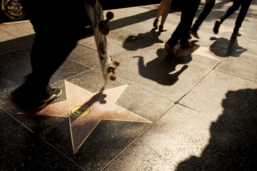 Pedestrians pass Alfred Hitchcock's star on the Walk of Fame in Hollywood, California, U.S. on Friday, July 22, 2011. Los Angeles, which is selling $380 million in debt, may benefit from demand for California bonds with long-term issuance at the lowest since 2000. Photographer: Konrad Fiedler/Bloomberg via Getty Images