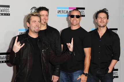 LOS ANGELES, CA - NOVEMBER 20: (L-R) Musicians Chad Kroeger, Daniel Adair, Mike Kroeger and Ryan Peake of Nickelback arrive at the 2011 American Music Awards held at Nokia Theatre L.A. LIVE on November 20, 2011 in Los Angeles, California. (Photo by Jason Merritt/Getty Images)