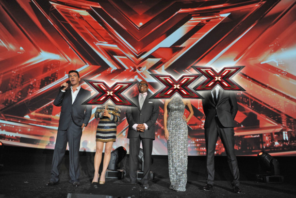 THE X FACTOR: (L-R) Simon Cowell, Paula Abdul, L.A. Reid, Nicole Scherzinger and Steve Jones address the audience at FOX's "The X Factor" World Premiere Screening Event at the Arclight Cinerama Dome on September 14, 2011 in Hollywood, California. The two-night series premiere of THE X FACTOR airs on Wednesday, September 21 (8-10pm ET/PT) and Thursday, September 22 (8-10pm ET/PT) on FOX. (Photo by Mark Davis/PictureGroup) THE X FACTOR: (L-R) Simon Cowell, Paula Abdul, L.A. Reid, Nicole Scherzinger and Steve Jones address the audience at FOX's "The X Factor" World Premiere Screening Event at the Arclight Cinerama Dome on September 14, 2011 in Hollywood, California. The two-night series premiere of THE X FACTOR airs on Wednesday, September 21 (8-10pm ET/PT) and Thursday, September 22 (8-10pm ET/PT) on FOX. (Photo by Mark Davis/PictureGroup)