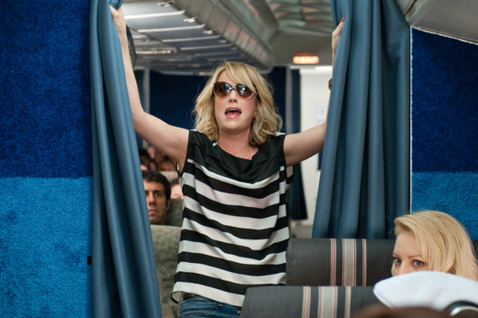 (L to R) In the comedy "Bridesmaids", KRISTEN WIIG stars as Annie, a maid of honor whose life unravels as she leads her best friend and a group of colorful bridesmaids—including Rita (WENDI MCLENDON-COVEY)—on a wild ride down the road to matrimony.