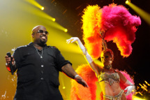 LAS VEGAS, NV - FEBRUARY 18: (EXCLUSIVE COVERAGE) Recording artist Cee Lo Green (L) performs with a showgirl from the Jubilee! production show at the Keep Memory Alive foundation's "Power of Love Gala" celebrating Muhammad Ali's 70th birthday at the MGM Grand Garden Arena February 18, 2012 in Las Vegas, Nevada. The event benefits the Cleveland Clinic Lou Ruvo Center for Brain Health and the Muhammad Ali Center. (Photo by Ethan Miller/Getty Images for Keep Memory Alive)