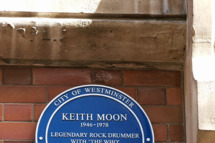 A wall plaque unveiled by British singer Roger Daltrey (unseen) is pictured high on the wall at 90 Wardour Street in London on March 8, 2009, in honour of the late Keith Moon, drummer for the rock band 'The Who', who died in 1978. AFP PHOTO/MAX NASH (Photo credit should read MAX NASH/AFP/Getty Images)