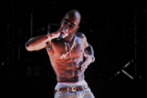 INDIO, CA - APRIL 15: A holographic image of Tupac Shakur is seen performing during day 3 of the 2012 Coachella Valley Music & Arts Festival at the Empire Polo Field on April 15, 2012 in Indio, California. (Photo by Kevin Winter/Getty Images for Coachella)