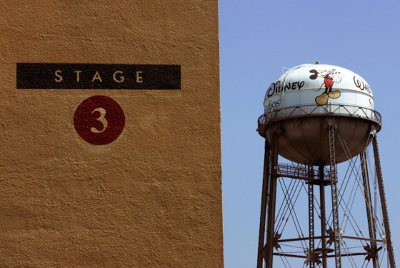 A water tower stands in the distance behind Stage 3 at Walt Disney Studios in Burbank, California, U.S., on Wednesday, June 30, 2010. U.S. customs officials began closing Web sites that offer pirated movies, fulfilling a promise to crack down on illegal downloads that Hollywood executives say cost the U.S. economy more than $20 billion a year. Photographer: Jonathan Alcorn/Bloomberg via Getty Images A water tower stands in the distance behind Stage 3 at Walt Disney Studios in Burbank, California, U.S., on Wednesday, June 30, 2010. U.S. customs officials began closing Web sites that offer pirated movies, fulfilling a promise to crack down on illegal downloads that Hollywood executives say cost the U.S. economy more than $20 billion a year. Photographer: Jonathan Alcorn/Bloomberg via Getty Images