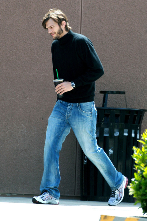 77638, LOS ANGELES, CALIFORNIA - Friday May 11, 2012. **EXCLUSIVE** Ashton Kutcher looks the spitting image of a young Steve Jobs as he grabs a coffee near his home before heading to a film studio. Kutcher is starring as the late Apple honcho in a new biopic that looks to have already started filming. Doing some serious method acting Ashton was really getting into character, sporting long hair, a beard, and the CEO's classic attire of New Balance sneakers, blue jeans, and a black turtleneck sweater and it's not hard to see why the 'Two and a Half Men' actor was chosen for the role. The producer of the film Mark Hulme, using the working title 'Jobs: Get Inspired', has said he chose Kutcher for the role because of his likeness to the Apple co-founder, especially during the period of time the film will cover, the early years of the Apple founder's life from 1971 until 2000. Photograph: Sam Sharma/Miguel Aguilar, ?PacificCoastNews.com **FEE MUST BE AGREED PRIOR TO USAGE** **E-TABLET/IPAD & MOBILE PHONE APP PUBLISHING REQUIRES ADDITIONAL FEES** LOS ANGELES OFFICE:+1 310 822 0419 LONDON OFFICE:+44 20 8090 4079
