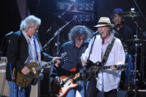 (L-R) Musicians Frank Sampedro, Billy Talbot, Neil Young, and Ralph Molina of the band Crazy Horse perform onstage on February 10, 2012 in Los Angeles, California. (L-R) Musicians Frank Sampedro, Billy Talbot, Neil Young, and Ralph Molina of the band Crazy Horse perform onstage on February 10, 2012 in Los Angeles, California.