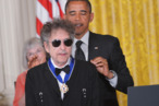 US President Barack Obama presents the Presidential Medal of Freedom to musician Bob Dylan during a ceremony on May 29, 2012 in the East Room of the White House in Washington. The award is the country's highest civilian honor. AFP PHOTO/Mandel NGAN (Photo credit should read MANDEL NGAN/AFP/GettyImages) US President Barack Obama presents the Presidential Medal of Freedom to musician Bob Dylan during a ceremony on May 29, 2012 in the East Room of the White House in Washington. The award is the country's highest civilian honor. AFP PHOTO/Mandel NGAN (Photo credit should read MANDEL NGAN/AFP/GettyImages)