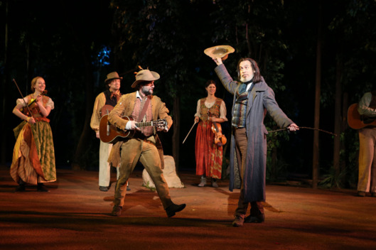 Jordan Tice and Stephen Spinella (foreground) in the Shakespeare in the Park production of As You Like It, directed by Daniel Sullivan, running as part of The Public Theater's Shakespeare in the Park