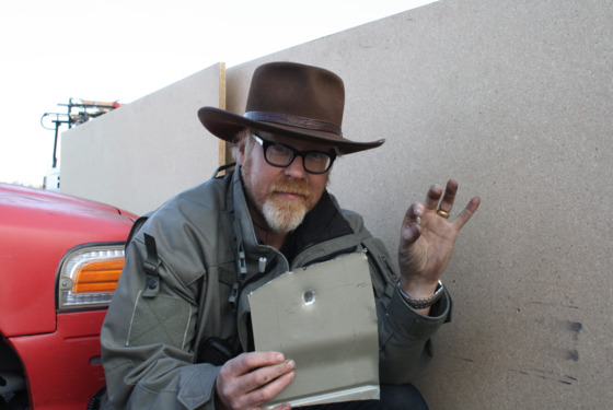 Episode Shooting Shenanigans. Host Adam Savage holding up bullet and the result of a sheet of metal being shot. Episode Shooting Shenanigans. Host Adam Savage holding up bullet and the result of a sheet of metal being shot.