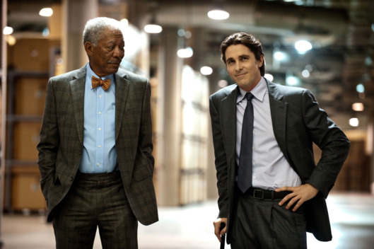 L-r: MORGAN FREEMAN as Lucius Fox and CHRISTIAN BALE as Bruce Wayne in Warner Bros. Pictures’ and Legendary Pictures’ action thriller “THE DARK KNIGHT RISES”