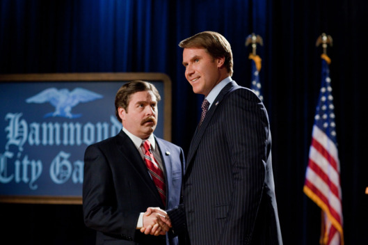 (L-r) ZACH GALIFIANAKIS as Marty Huggins and WILL FERRELL as Cam Brady in Warner Bros. Pictures’ comedy “THE CAMPAIGN”