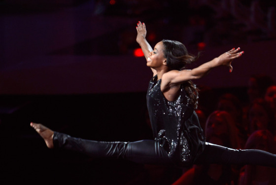 LOS ANGELES, CA - SEPTEMBER 06: Gabby Douglas performs onstage while Alicia Keys sings during the 2012 MTV Video Music Awards at Staples Center on September 6, 2012 in Los Angeles, California. (Photo by Kevin Mazur/WireImage) LOS ANGELES, CA - SEPTEMBER 06: Gabby Douglas performs onstage while Alicia Keys sings during the 2012 MTV Video Music Awards at Staples Center on September 6, 2012 in Los Angeles, California. (Photo by Kevin Mazur/WireImage)