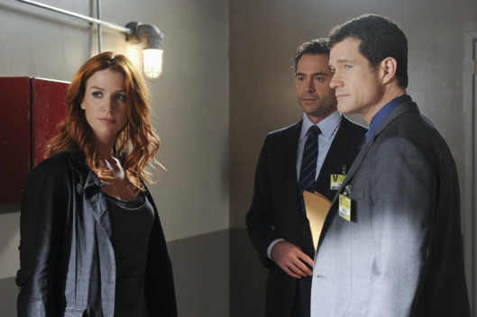 "Check Out Time" --ADA Adam Gilroy (Omar Metwally, center) discusses the case against a suspect in the murder of a hotel guest with Detectives Carrie Wells (Poppy Montgomery) and Al Burns (Dylan Walsh, right), on UNFORGETTABLE