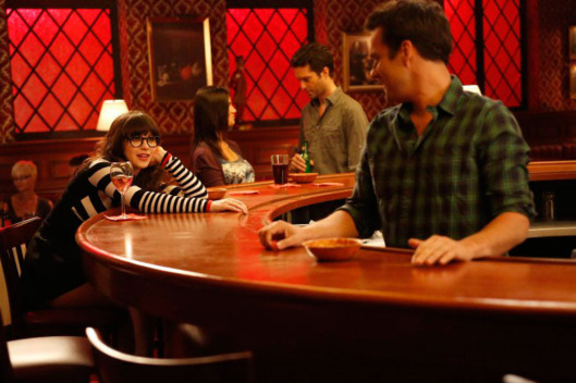 NEW GIRL: Jess (Zooey Deschanel, L) contemplates her relationship with Nick (Jake Johnson, R) in the "Fluffer" episode of NEW GIRL airing Tuesday, Oct. 2 (9:00-9:30 PM ET/PT) on FOX. ©2012 Fox Broadcasting Co.