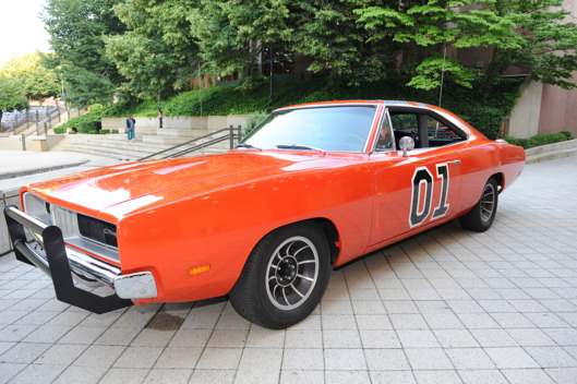 Singer / Actor/ Politician BEN JONES who played COOTER DAVENPORT in the hit television show The Dukes of Hazzard poses with the famed car from the television series The General Lee while at The Carolina Theater located in Durham.