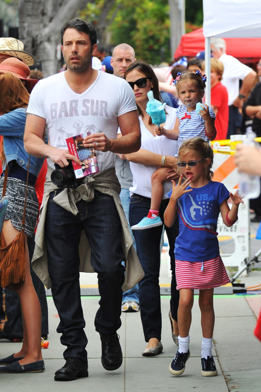 Ben Affleck and Jennifer Garner take their girls to a 4th of July parade.