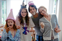 (L to R) Charlotte (IRIS APATOW), Sadie (MAUDE APATOW), Pete (PAUL RUDD) and Debbie (LESLIE MANN) in "This Is 40", an original comedy from writer/director/producer Judd Apatow.