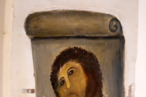 View of the deteriorated version of "Ecce Homo" by 19th-century painter Elias Garcia Martinez, at the Borja Church in Zaragoza on August 28, 2012. An elderly woman's catastrophic attempt to "restore" a century-old oil painting of Christ in a Spanish church has provoked popular uproar, and amusement. Titled "Ecce Homo" (Behold the Man), the original was no masterpiece, painted in two hours in 1910 by a certain Elias Garcia Martinez directly on a column in the church at Borja, northeastern Spain. The well-intentioned but ham-fisted amateur artist, in her 80s, took it upon herself to fill in the patches and paint over the original work, which depicted Christ crowned with thorns, his sorrowful gaze lifted to heaven. View of the deteriorated version of "Ecce Homo" by 19th-century painter Elias Garcia Martinez, at the Borja Church in Zaragoza on August 28, 2012. An elderly woman's catastrophic attempt to "restore" a century-old oil painting of Christ in a Spanish church has provoked popular uproar, and amusement. Titled "Ecce Homo" (Behold the Man), the original was no masterpiece, painted in two hours in 1910 by a certain Elias Garcia Martinez directly on a column in the church at Borja, northeastern Spain. The well-intentioned but ham-fisted amateur artist, in her 80s, took it upon herself to fill in the patches and paint over the original work, which depicted Christ crowned with thorns, his sorrowful gaze lifted to heaven.