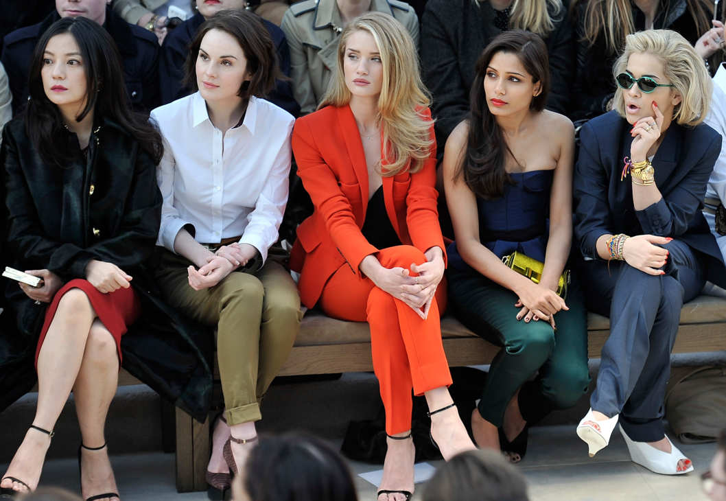 LONDON, ENGLAND - FEBRUARY 18: (L-R) Vicki Zhao, Michelle Dockery, Rosie Huntington-Whiteley, Freida Pinto and Rita Ora sit in the front row for the Burberry Prorsum Autumn Winter 2013 Womenswear show on February 18, 2013 in London, England. (Photo by Gareth Cattermole/Getty Images for Burberry)