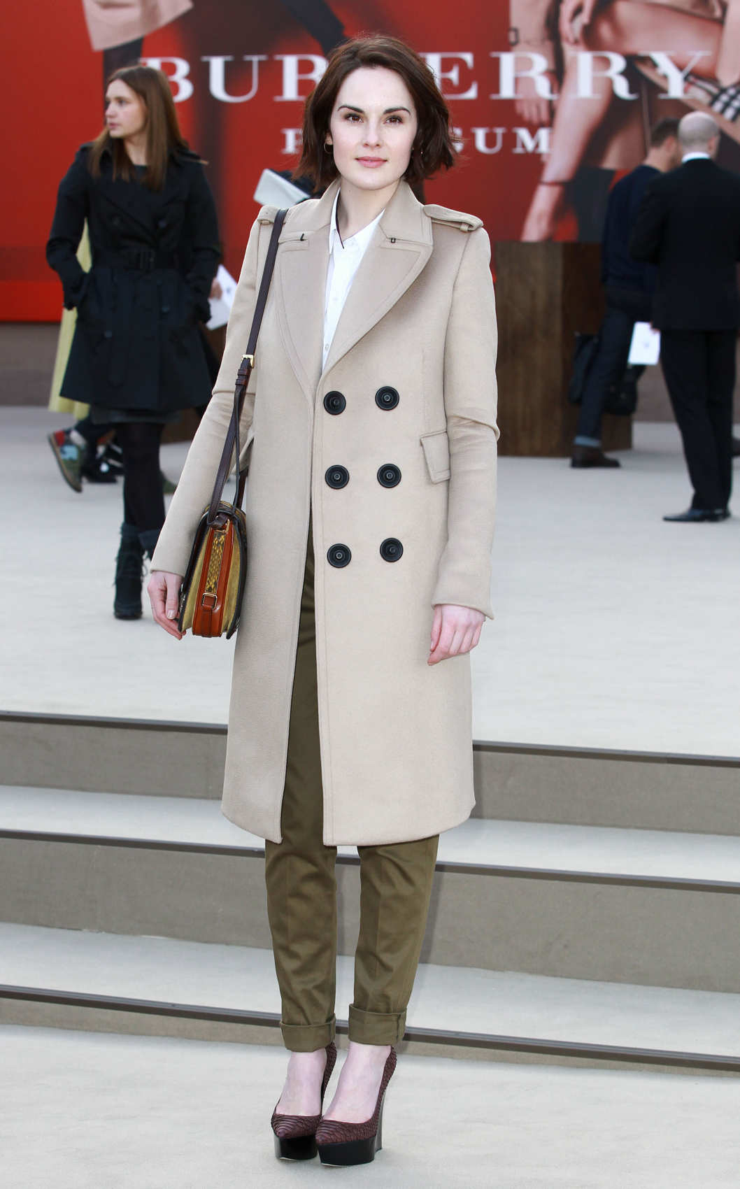 LONDON, UNITED KINGDOM - FEBRUARY 18: Michelle Dockery attends the Burberry Prorsum show during London Fashion Week Fall/Winter 2013/14 at on February 18, 2013 in London, England. (Photo by Fred Duval/Getty Images)